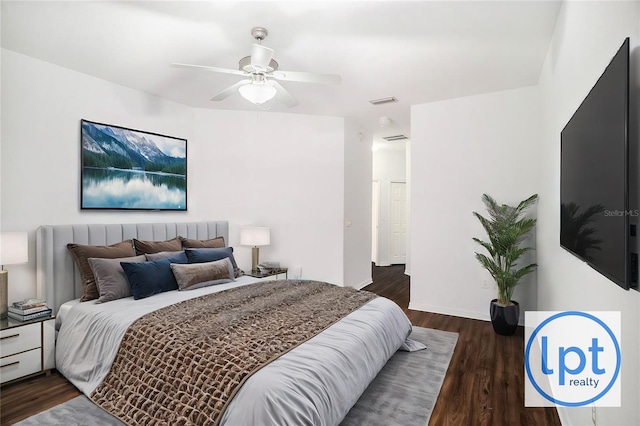 bedroom featuring ceiling fan and dark hardwood / wood-style floors