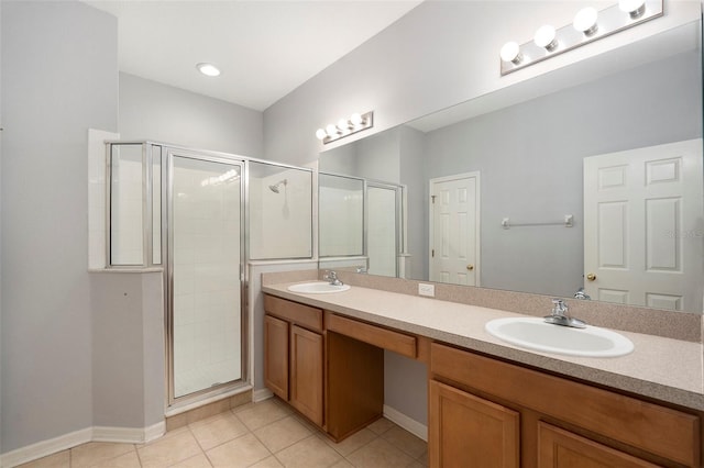 bathroom featuring vanity, tile patterned floors, and an enclosed shower