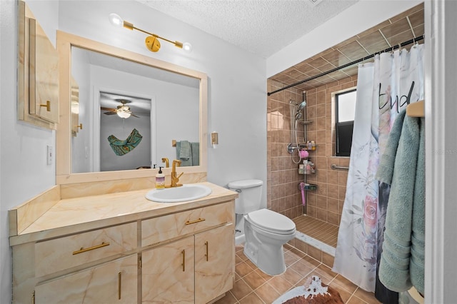 bathroom featuring vanity, tile patterned floors, a shower with shower curtain, toilet, and a textured ceiling