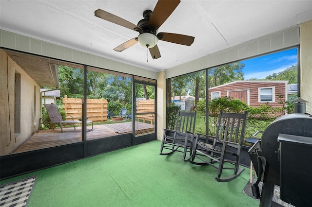 sunroom / solarium with ceiling fan