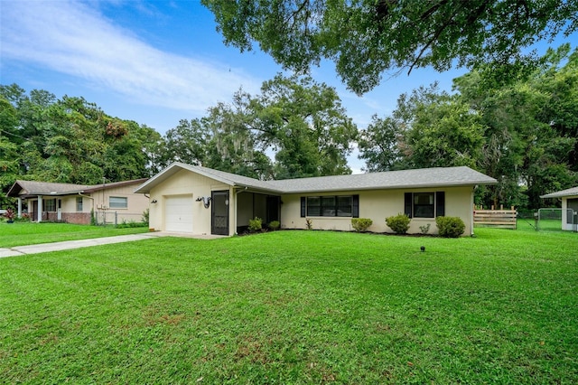 single story home with a front lawn and a garage