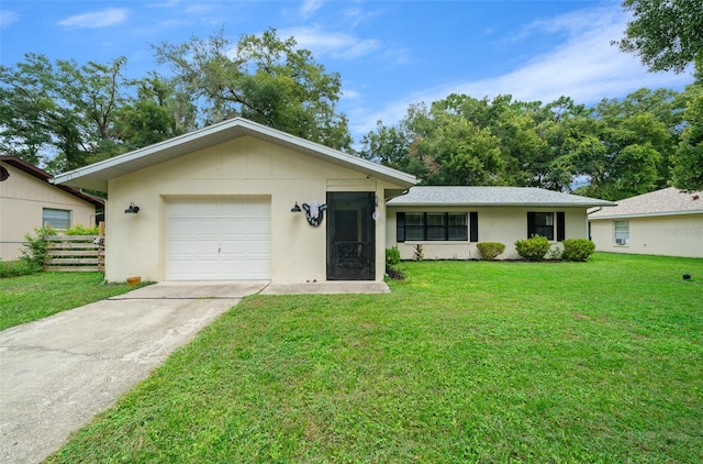 ranch-style house featuring a front yard and a garage