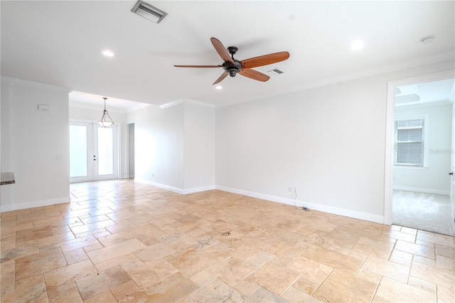 spare room with ceiling fan, ornamental molding, and french doors