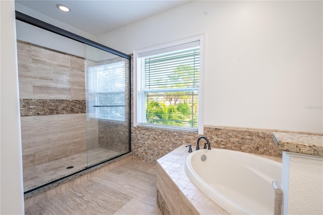 bathroom featuring separate shower and tub and tile patterned flooring