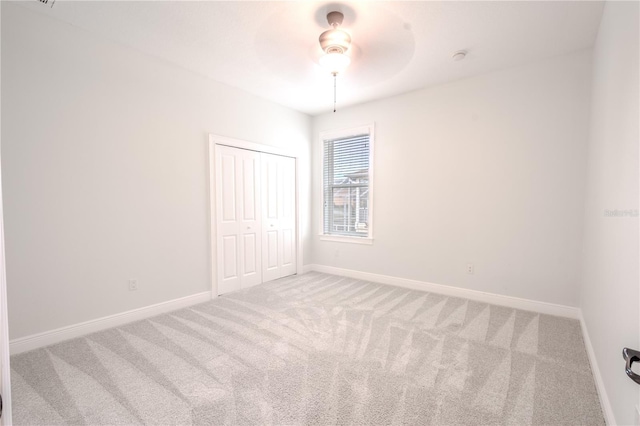 spare room with ceiling fan and carpet floors