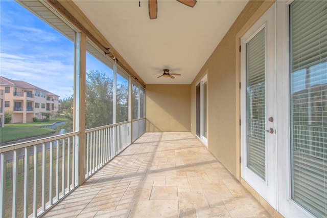 exterior space with ceiling fan