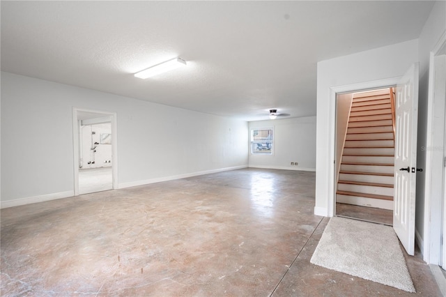 basement featuring a textured ceiling