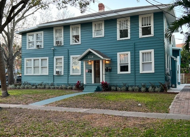 colonial inspired home with cooling unit