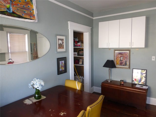 home office with dark wood-type flooring