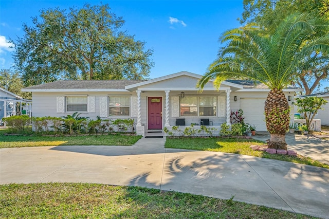 ranch-style home with a garage and a front yard