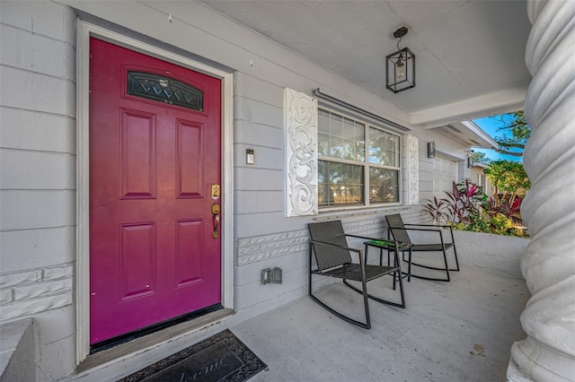 doorway to property featuring a porch