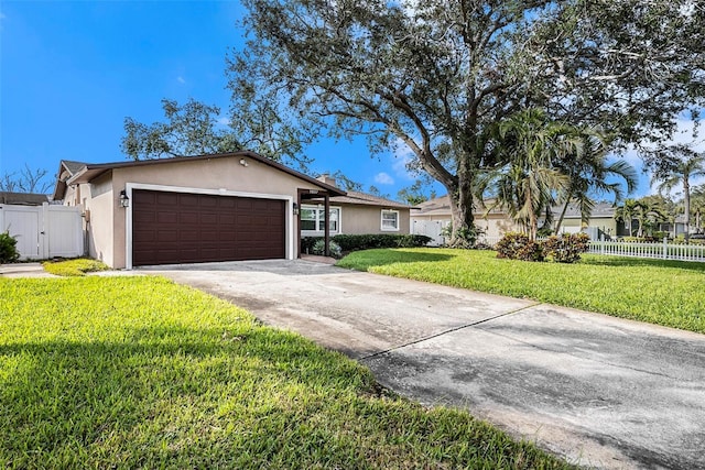 single story home with a garage and a front yard