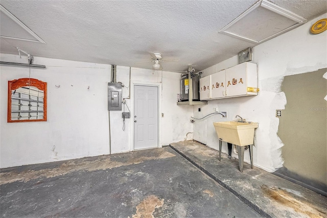 garage with sink, electric panel, ceiling fan, and water heater