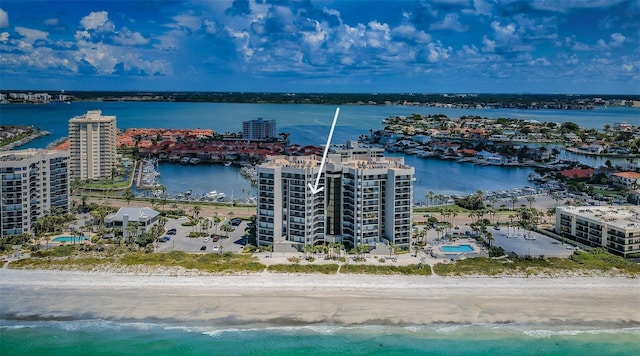 birds eye view of property featuring a view of the beach and a water view