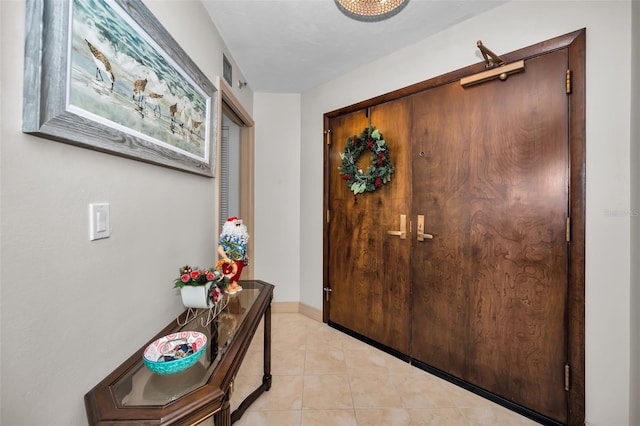 entrance foyer featuring light tile patterned floors