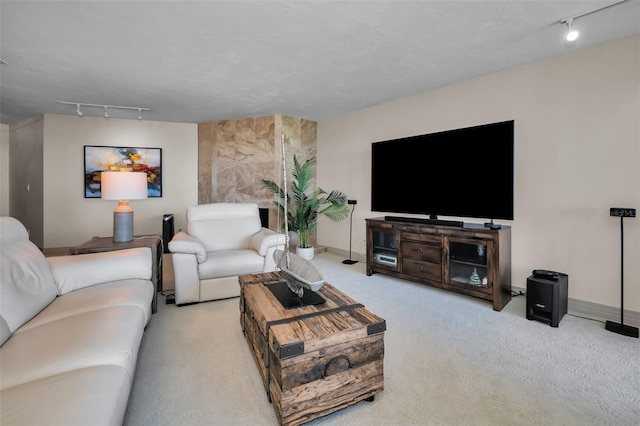 living room featuring rail lighting and light carpet