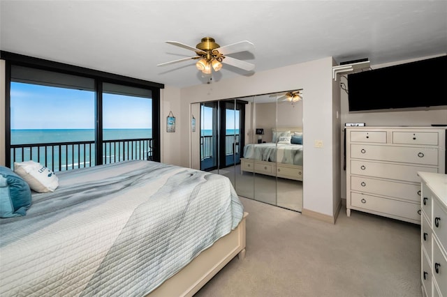 bedroom featuring ceiling fan, access to exterior, and light carpet