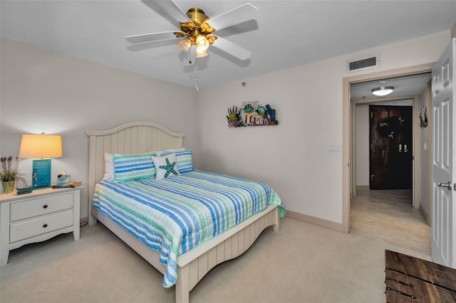 bedroom featuring ceiling fan and light colored carpet