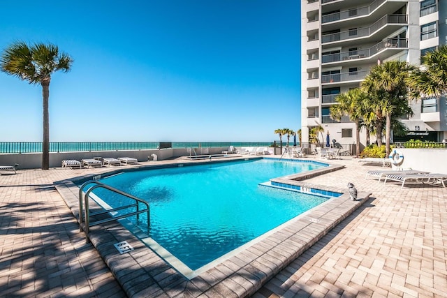 view of swimming pool with a patio area