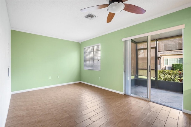 empty room featuring crown molding, ceiling fan, and light wood-type flooring