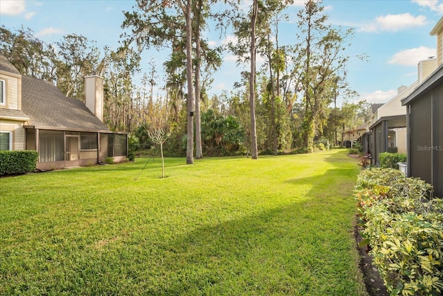 view of yard with a sunroom