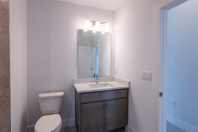 475 Winwood Ct, Port Charlotte, FL 33954 - bathroom with toilet, vanity, and baseboards