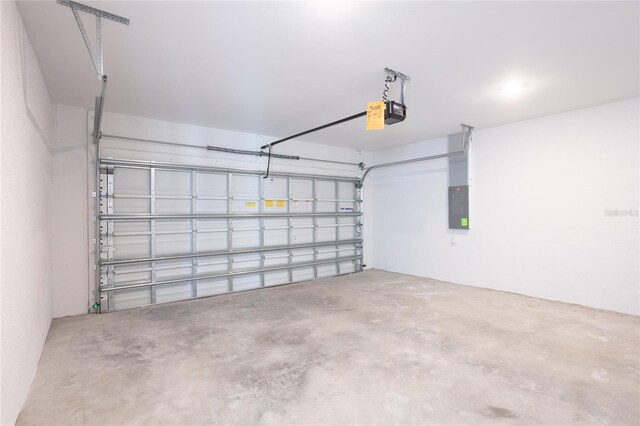 475 Winwood Ct, Port Charlotte, FL 33954 - garage featuring electric panel and a garage door opener