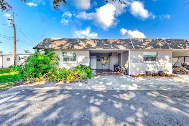 view of front of home with a carport