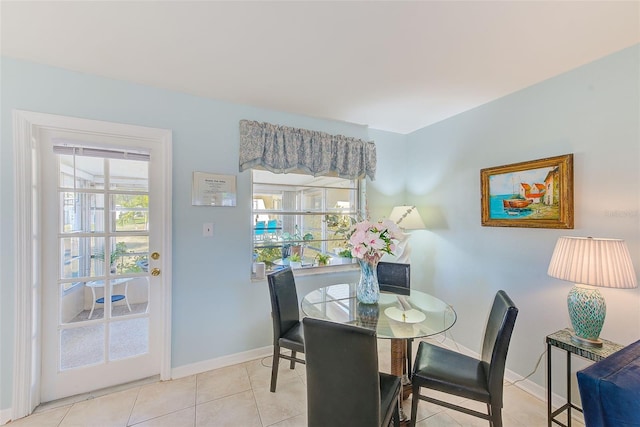 dining area featuring light tile patterned flooring