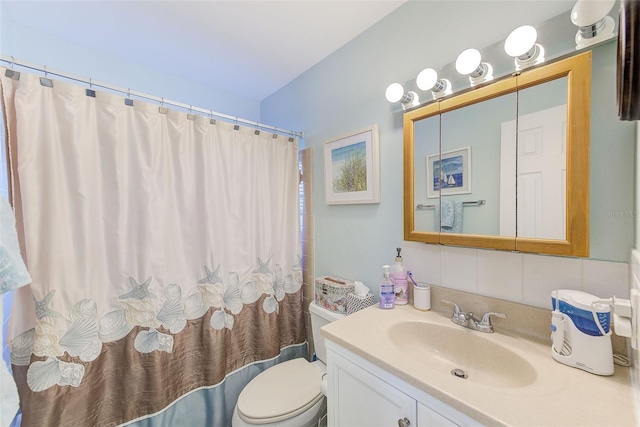 full bathroom featuring vanity, toilet, shower / bathtub combination with curtain, and backsplash