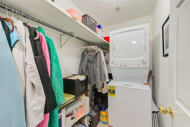 laundry area featuring stacked washer and clothes dryer