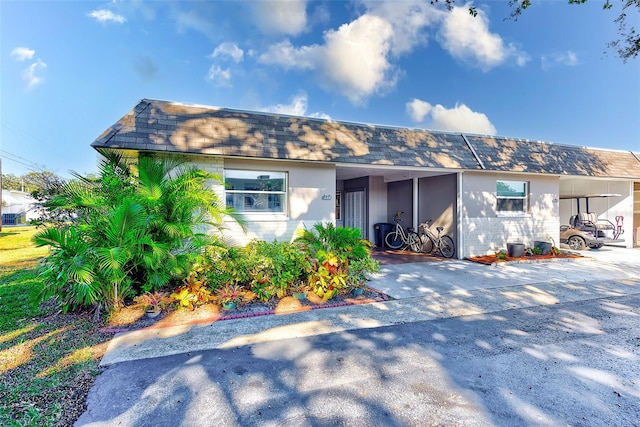 view of front of home featuring a carport