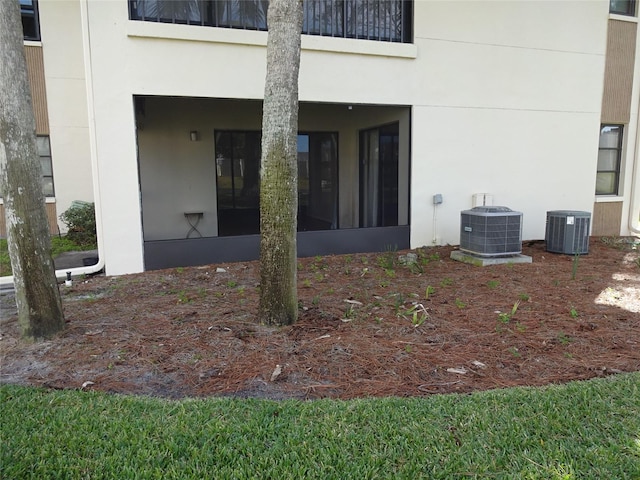 property entrance featuring central AC unit