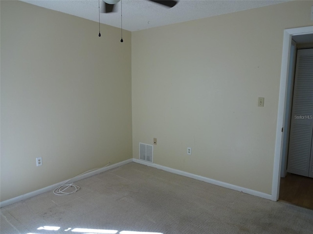 carpeted empty room with ceiling fan