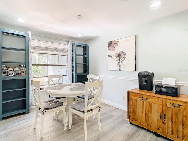 dining room with light wood-type flooring