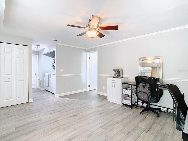 office space with washer and dryer, light hardwood / wood-style floors, and ornamental molding