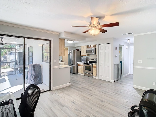 kitchen with ceiling fan, ornamental molding, appliances with stainless steel finishes, and light hardwood / wood-style flooring