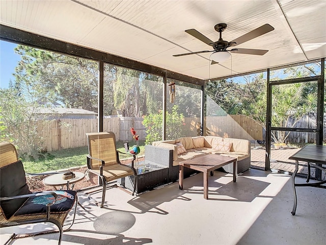 sunroom / solarium featuring ceiling fan and a healthy amount of sunlight