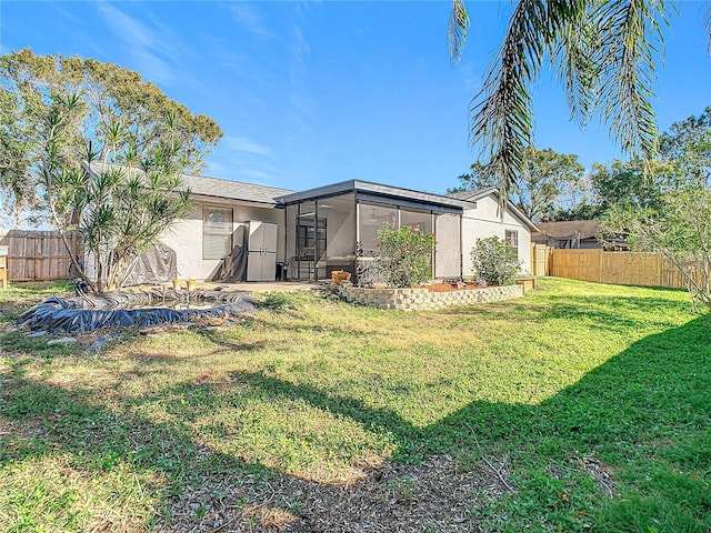 view of yard with a sunroom