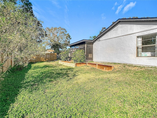 view of yard featuring a sunroom