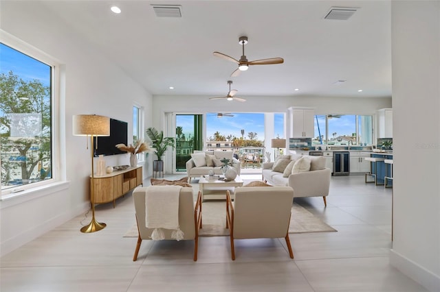 living room with wine cooler and plenty of natural light