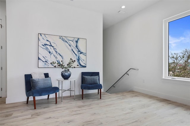 sitting room featuring light hardwood / wood-style floors