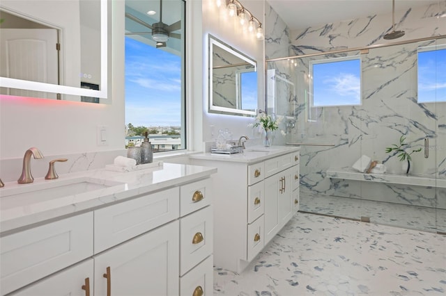 bathroom featuring vanity, walk in shower, and ceiling fan