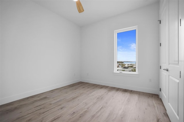 spare room with ceiling fan and light hardwood / wood-style flooring