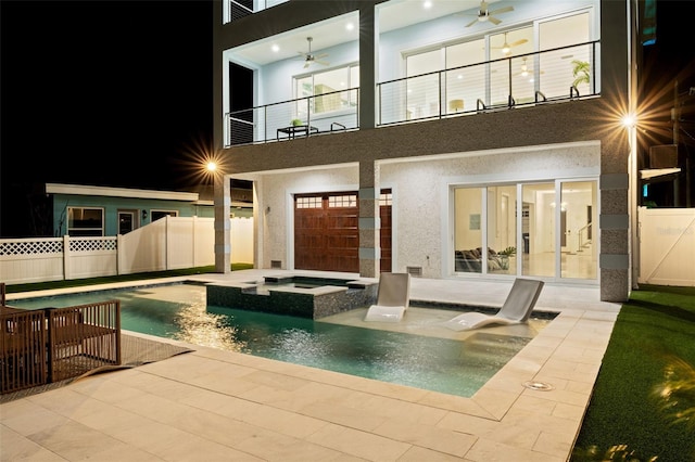 view of pool with a patio area, an in ground hot tub, and ceiling fan