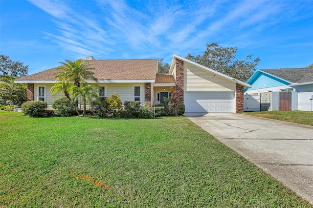 ranch-style house with a garage and a front lawn