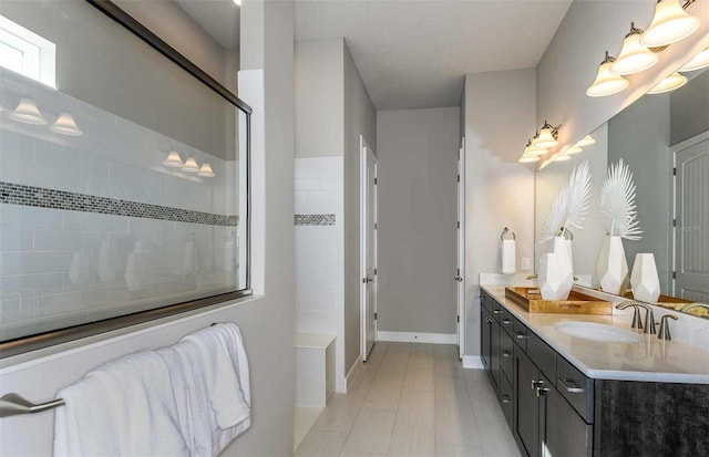 bathroom with vanity and walk in shower