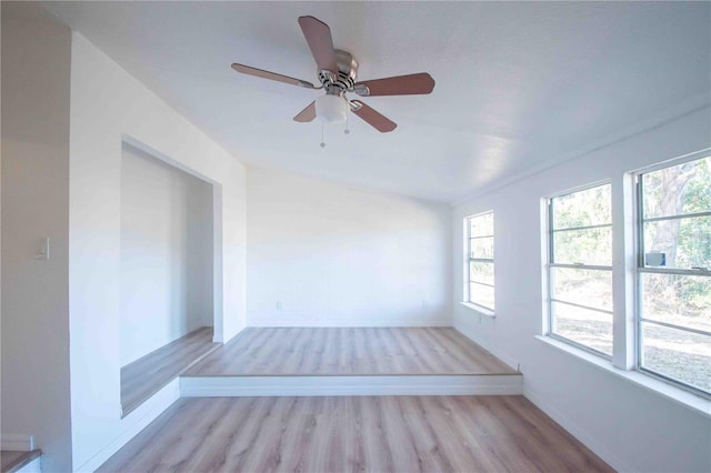 empty room with light wood-type flooring and ceiling fan