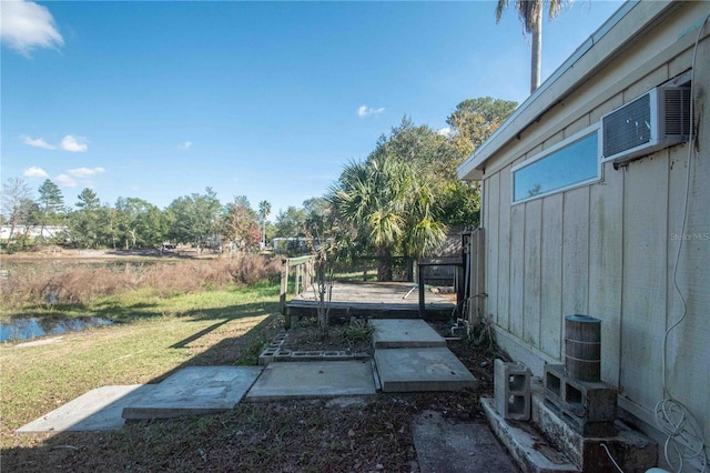 view of yard featuring a water view and a patio area