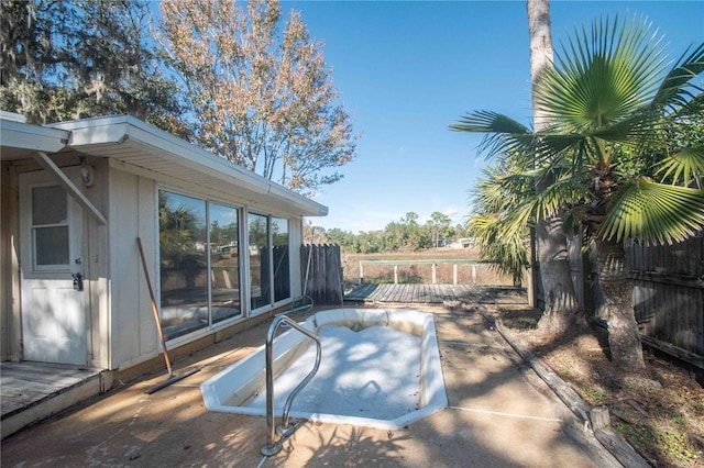 view of pool featuring a patio area and a hot tub